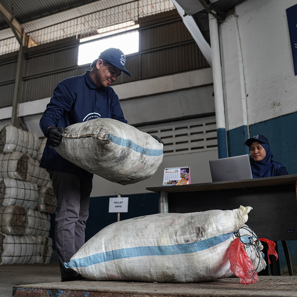 Collected plastic being registered at the sorting station