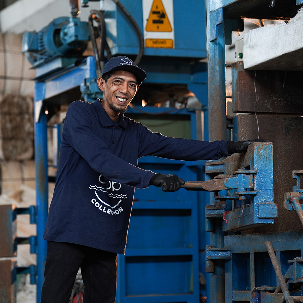 Worker at the bale press
